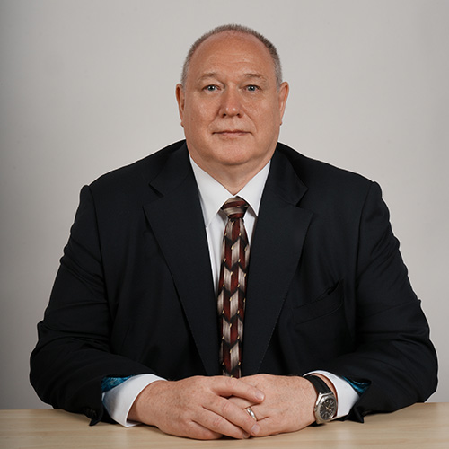 Professor Graham Kendall, sitting at desk.